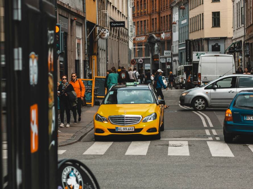 Street with yellow taxi.