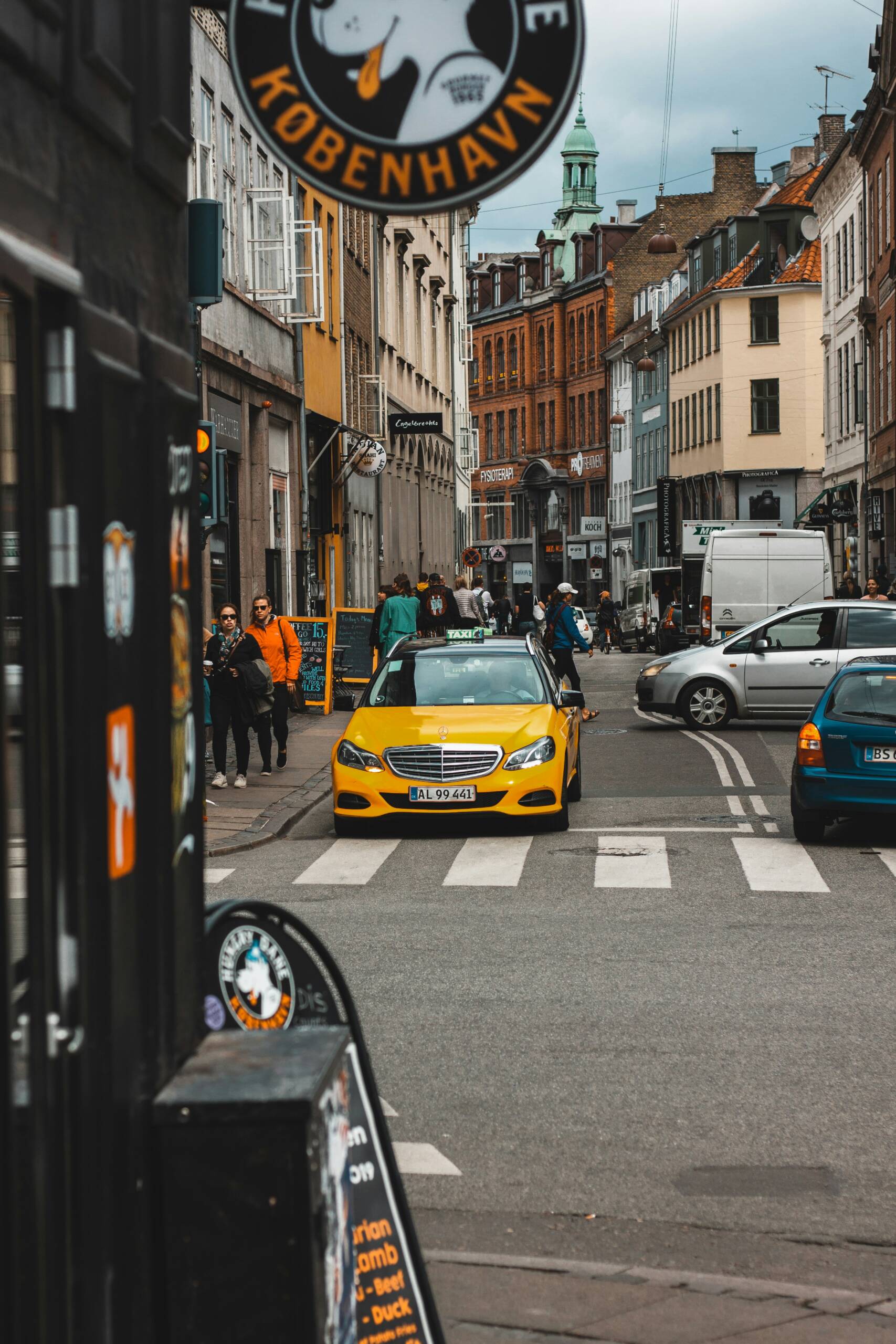 Street with yellow taxi.