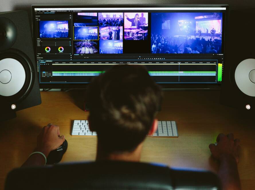 A guy doing video editing on his computer.