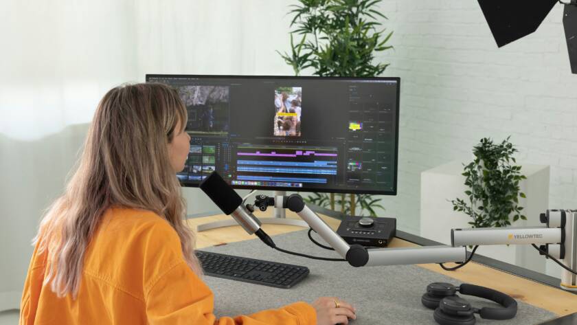 A girl doing video editing on her computer.