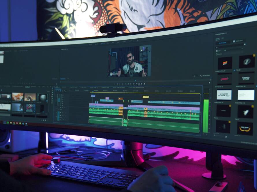 Video editing software on a long computer screen.