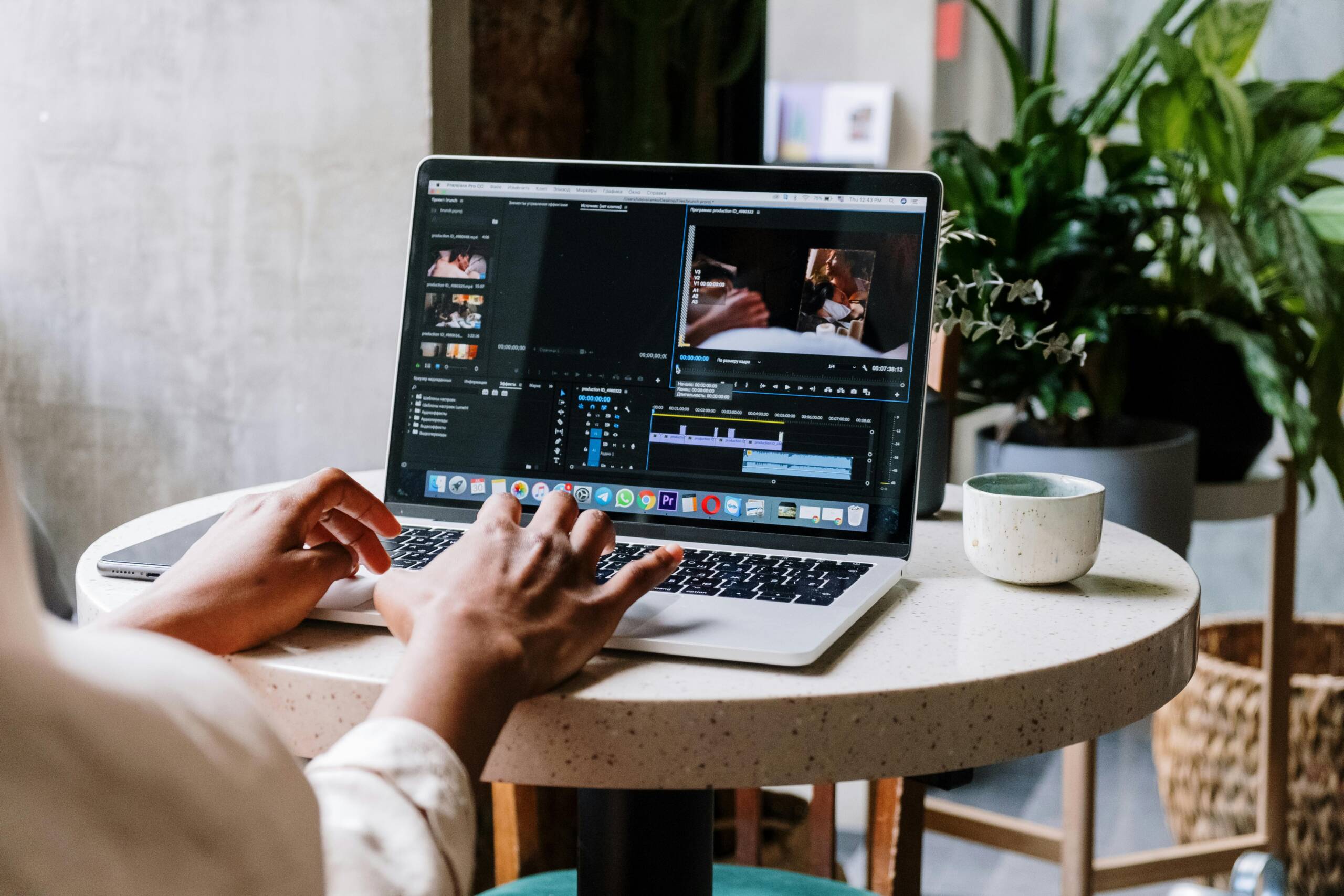 A girl video editing on her computer.